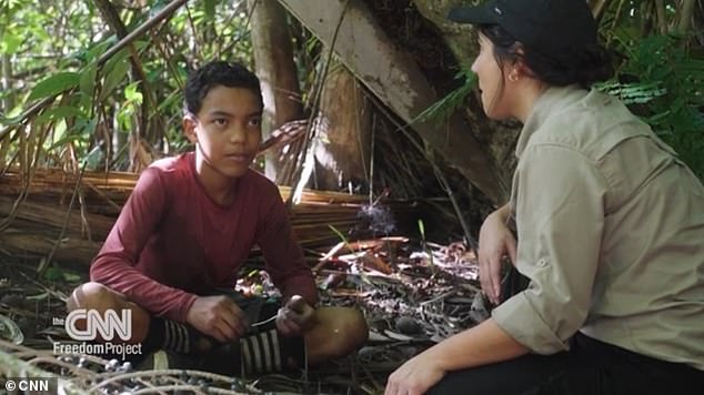 A hard-hitting documentary has shed light on the dangerous child labor involved in harvesting acai berries.  In the photo, journalist Julia Vargas Jones with acai collector Lucas Oliviera, 13 years old.