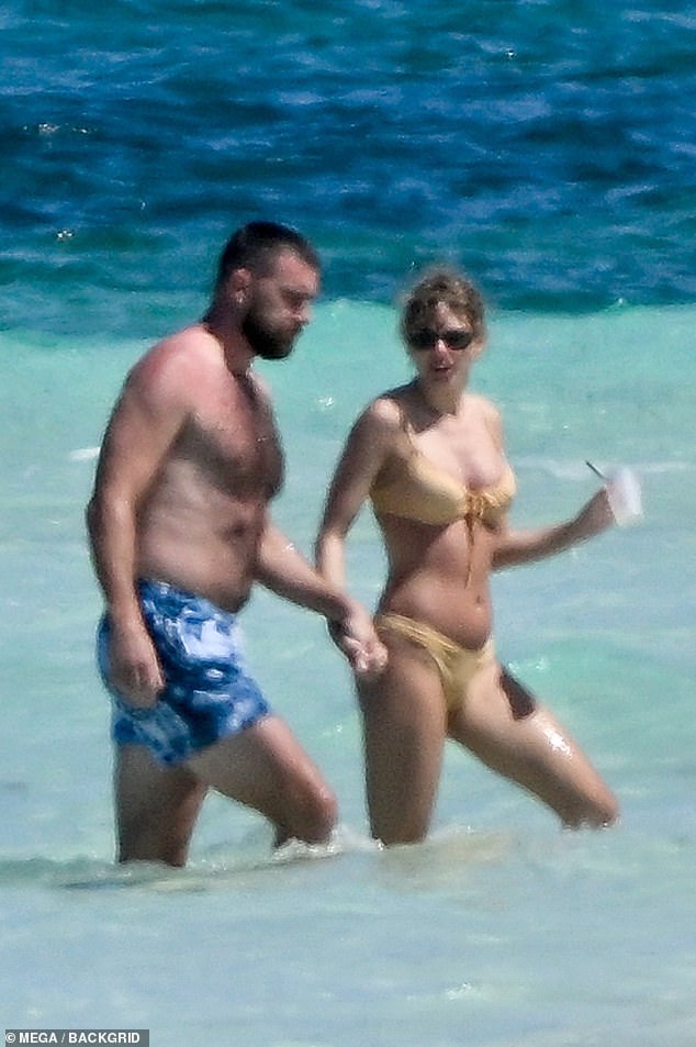 Swift and Kelce were spotted walking on the beach in the Bahamas during their vacation after the singer wrapped up her concert series in Singapore.