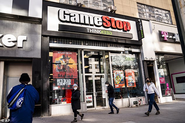 Pedestrians walk past a GameStop store on 14th Street in Union Square in Manhattan on January 28. The GameStop saga has been described by some as a victory for the little guy over the giants of Wall Street.