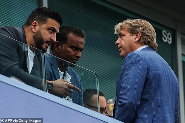 Constable Saif Rubie (left), pictured chatting to Chelsea owner Todd Boehly in September, was charged with making malicious communications by the Metropolitan Police last week.