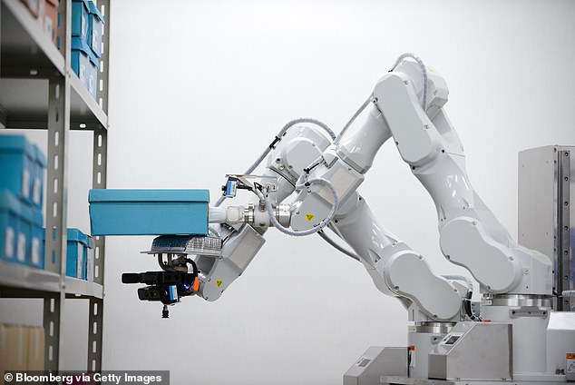 The illustrative image shows a robot arm used in a factory in Japan