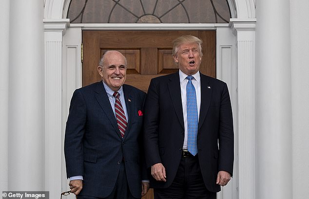 Former New York Mayor Rudy Giuliani (left) and President-elect Donald Trump (right) pose for a photo in Bedminster in November 2016, weeks after Trump won the 2016 race. Giuliani became the Trump's lawyer and led efforts to overturn Biden's victory four years later.