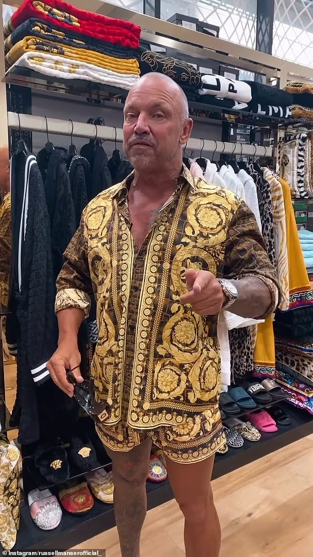 Pictured: Russell Manser in a designer clothing store in Melbourne.
