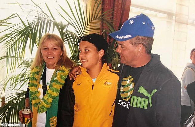 Kerr, the 2018 Young Australian of the Year, will seek to have the charge, which arose from an alleged dispute over a taxi fare, dismissed in court. She appears in the photo with her parents.