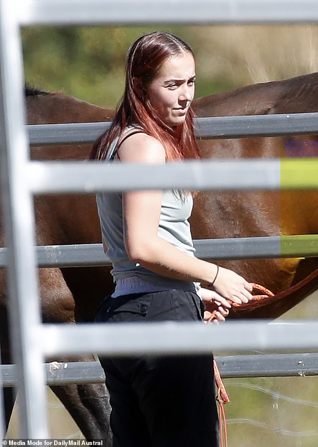 Ms Harbor was seen tending horses on her family's rural property on Friday.