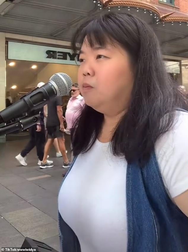Busker Widya Tjong has shared a TikTok video of her row with another performer over a venue on a busy shopping strip in Sydney
