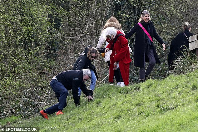 Sarah Jessica Parker's husband Matthew Broderick was seen falling while enjoying a muddy walk in London's Hampstead Heath on Saturday.