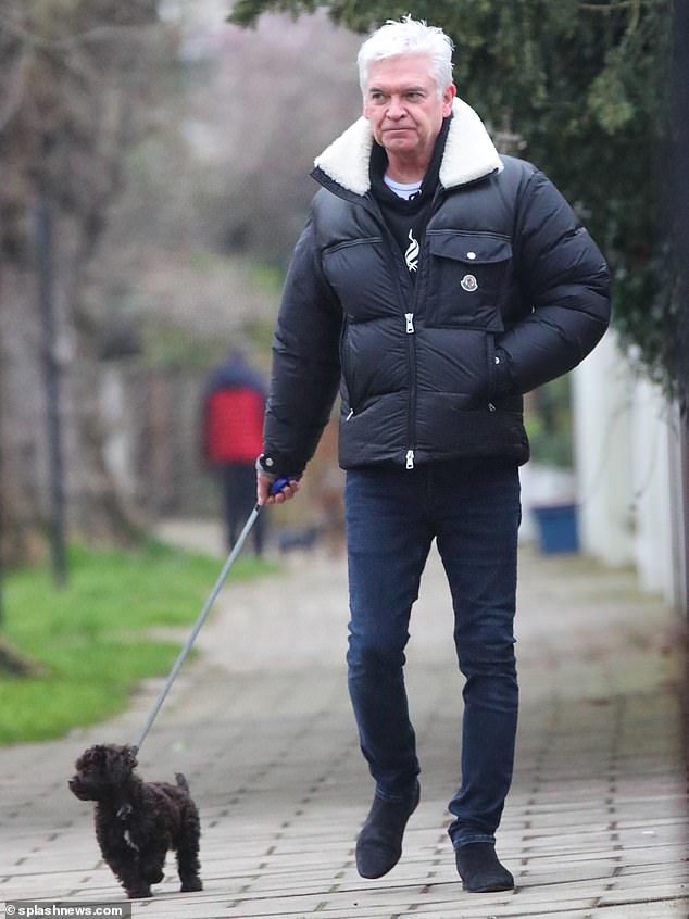Disgraced former This Morning host Phillip Schofield cut a sombre figure as he walked his puppy in west London on Monday as the new presenters made their debut
