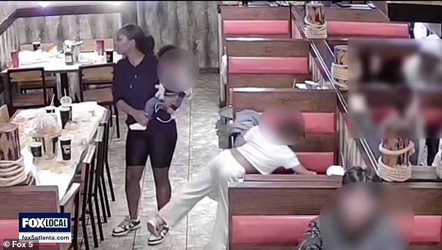 A mother was caught on camera telling her daughter to steal a purse from a stall at a Georgia restaurant.