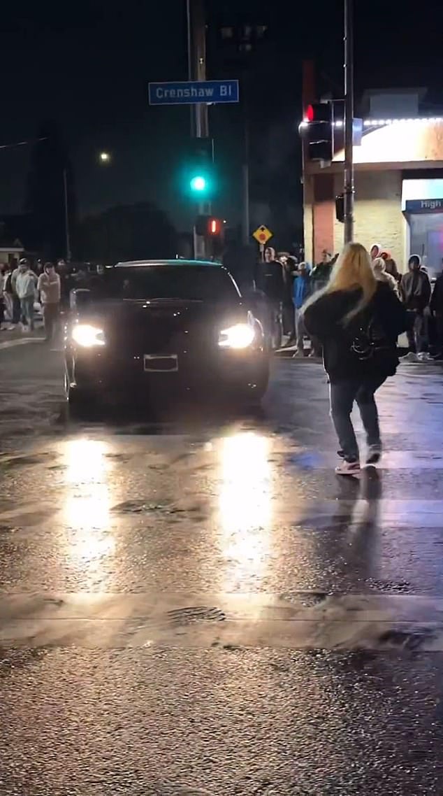 Video posted on social media shows a woman hit by a car and thrown to the ground at a notorious intersection in Los Angeles