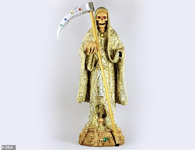Seized by the DEA in 2011 from two women transporting over 700 grams of methamphetamine between Arizona and Minnesota, this statue of Saint Death was painted gold to represent economic power, success and prosperity