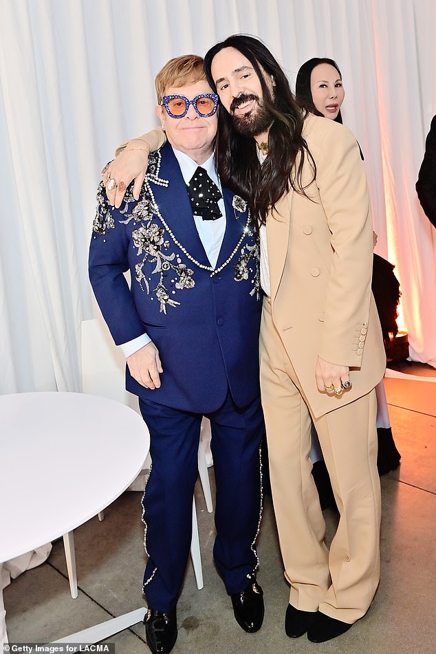 Elton also has a long-standing association with rival fashion house Gucci, where the brand was until recently headed by his friend Alessandro Michele (pictured with Alessandro Michele wearing Gucci in November)