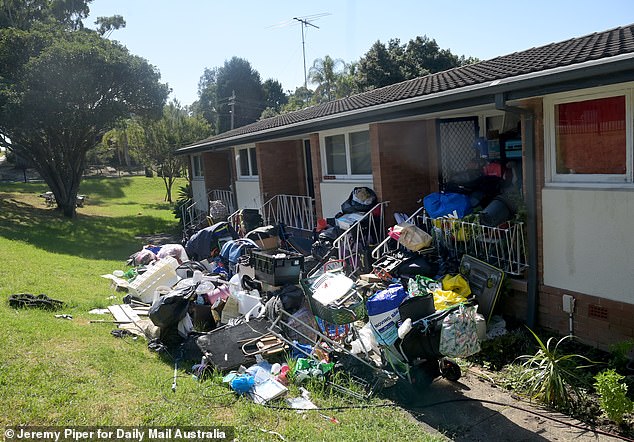 Unit 4 at the Herring Road block in Marsfield in Sydney's North West is flooded with rubbish and rubbish