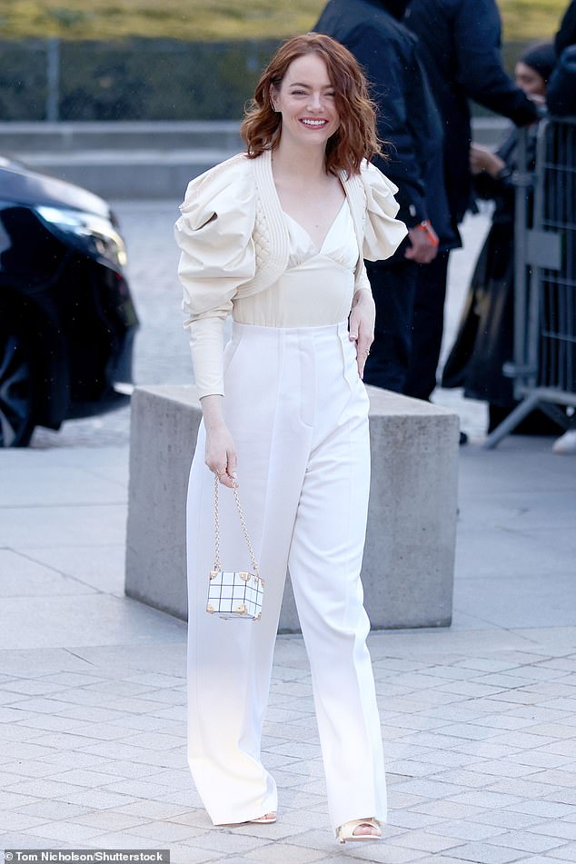 The award-winning actress, 35, opted for a cream-colored silk top that she paired with a short jacket that featured exaggeratedly puffed sleeves at the shoulders.