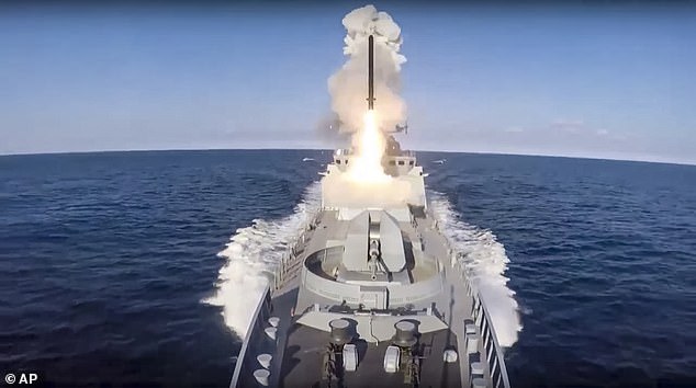 US intelligence agencies warned on Monday that it faces threats from an 'increasingly fragile world order', as Russia and China jockey for position amid regional conflicts, economic strains and accelerating artificial intelligence.  Seen here, the Russian frigate of the Black Sea Fleet fires a Caliber cruise missile from the Black Sea