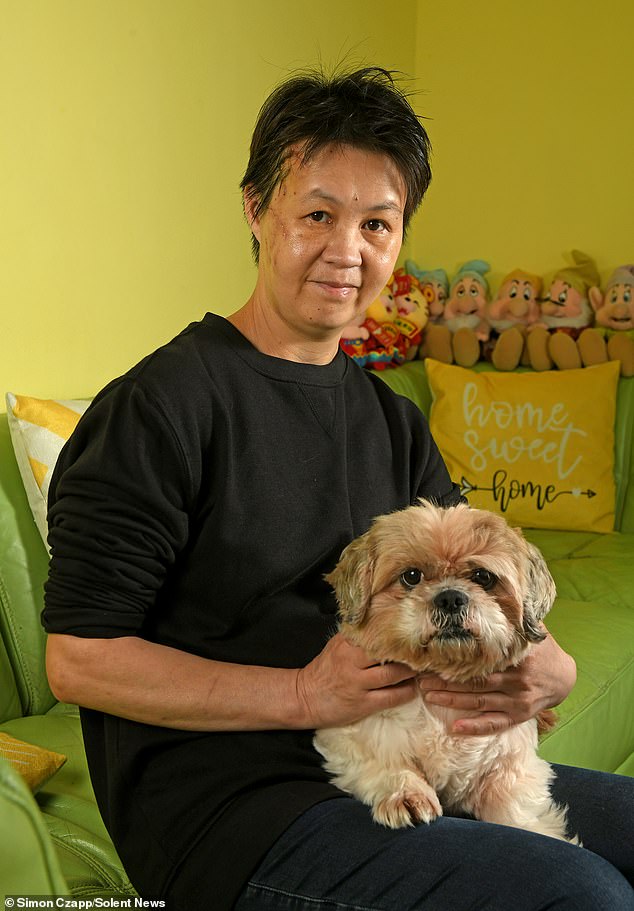 Shue Leung, 52, (pictured with her dog Mushroom) had been walking her Shih Tzu when she was pulled to the ground by the Rottweiler