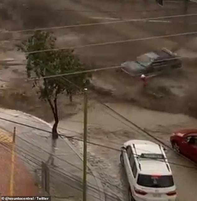 Torrential rain caused reservoirs to overflow in La Paz, Bolivia on Wednesday.  In one incident, a man was crossing the street when water rushed over a reservoir wall and knocked him to the ground