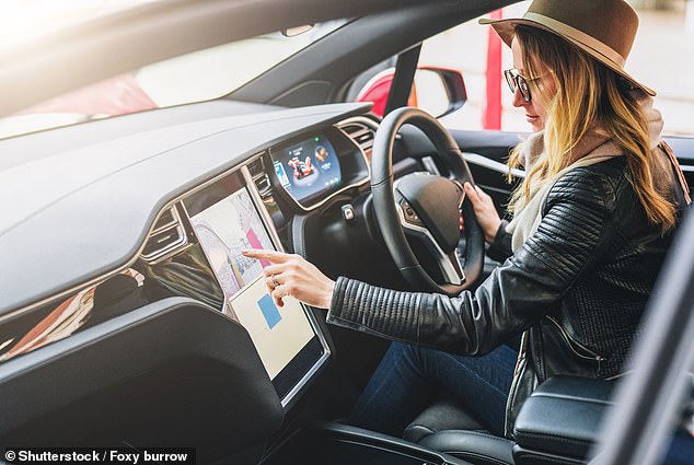 A man claims his mother's abusive husband forced her to buy a Tesla so he could use the electric vehicle's security features to track her every move.  stock image