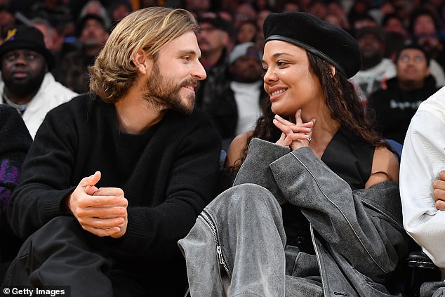 Tessa Thompson has sparked romance rumors with Brandon Green after the pair were seen putting on a cozy display at a basketball game on Wednesday.