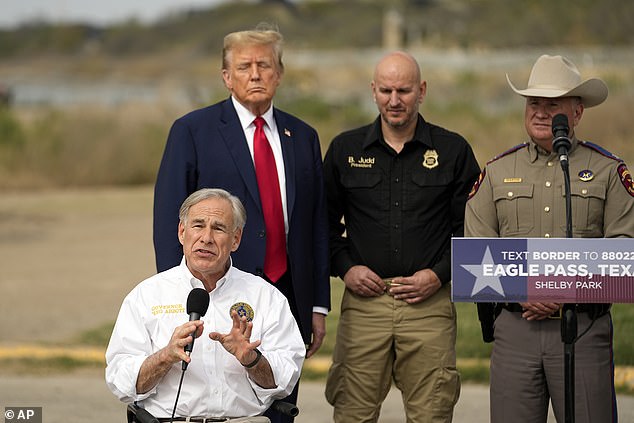 Republican presidential candidate Former President Donald Trump listens as Texas Gov. Greg Abbott speaks at Shelby Park on the U.S.-Mexico border, Thursday, Feb. 29, 2024, in Eagle Pass, Texas.