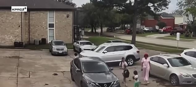 The little girl is seen moments before the driver hits her with the car as the other passengers drive away.