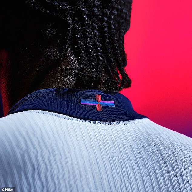 Nike's decision to replace the horizontal line of the traditional red cross on the back of England's Euro 2024 shirt with a navy blue, light blue and pink has caused controversy