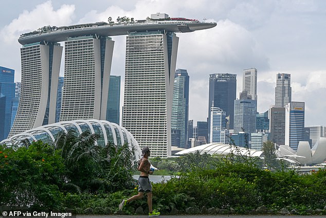 Australia is the top destination for real estate investors in Singapore as its millionaires look for somewhere to retire or send their children to study (pictured is Marina Bay Sands in Singapore)