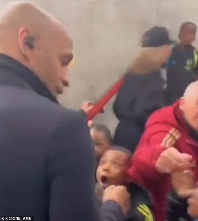 Henry was mobbed by surprised Arsenal academy graduates on his way to the ground.
