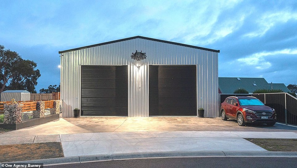 A simple steel shed hides a bachelor's dream home, complete with a huge workshop, a games room and a modern one-bedroom apartment.