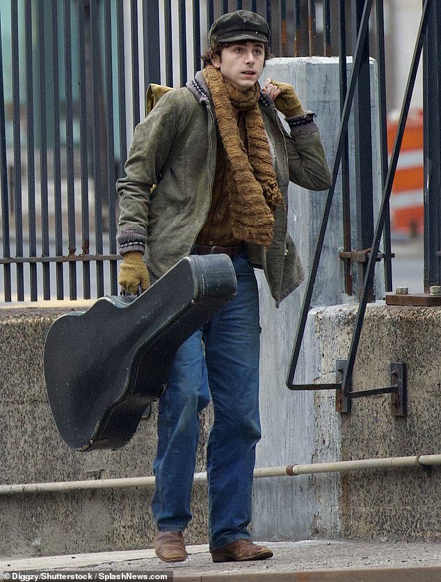Timothée Chalamet kept it casual as he stepped out in a gambler's hat and fingerless gloves to portray Bob Dylan while filming the singer-songwriter's biopic in New York City on Sunday.