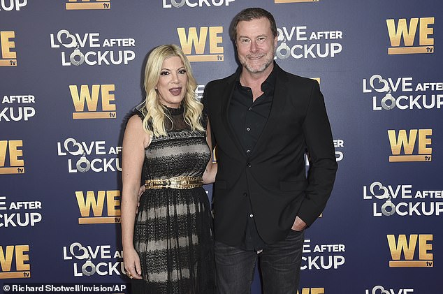 Tori Spelling is learning to navigate life amid her divorce from Dean McDermott when a new source revealed Sunday what steps she's taking to become independent;  seen in 2018