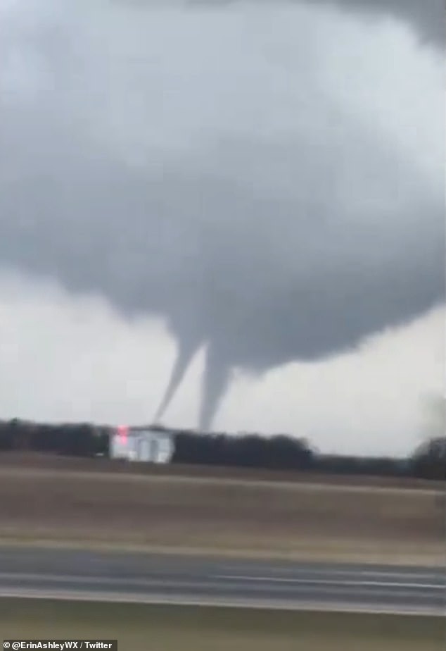 Terrifying footage from shows a double vortex twister tearing along the side of the road near the town of Vanlue in Ohio