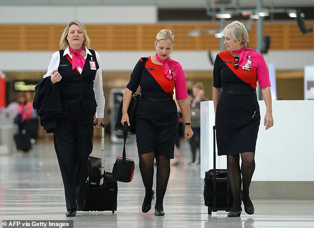 Troubled airline Qantas faces a multi-million dollar compensation bill after being found guilty of illegally laying off 1,700 workers during the Covid pandemic.  Flight attendants in photos
