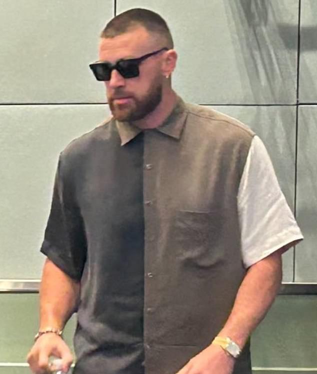 Travis Kelce sent Taylor Swift fans into a frenzy on Wednesday while wearing a shirt in the color palette of his new album The Tortured Poets Department.