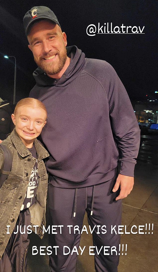 Travis Kelce posed for a photo with a young fan in Cleveland on Friday night.