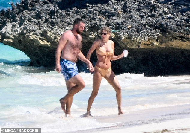 Photos of Swift and Kelce on a beach in the Bahamas went viral on Monday with both of them in swimsuits