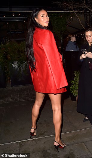 The TV star showed off her black Louboutin heels as she headed to the party.