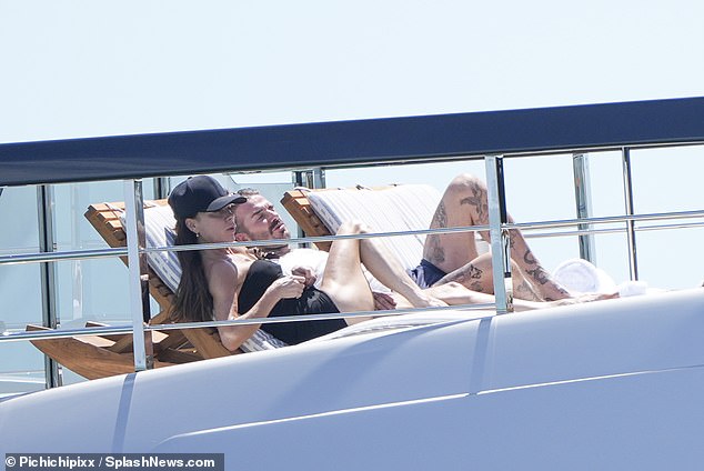 Victoria Beckham and her husband David were sunbathing on their luxury £5million superyacht Seven in Miami on Monday.