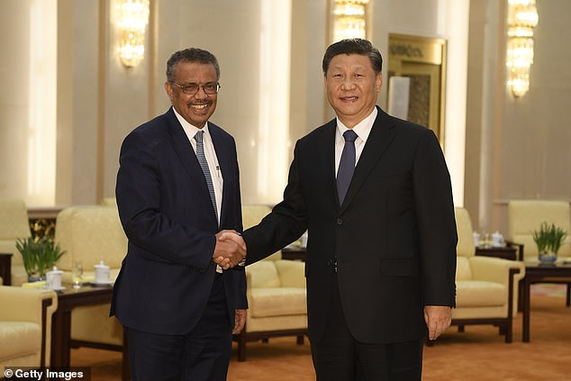 Tedros Adhanom, director general of the World Health Organization, (left) shakes hands with Chinese President Xi Jinping in 2020