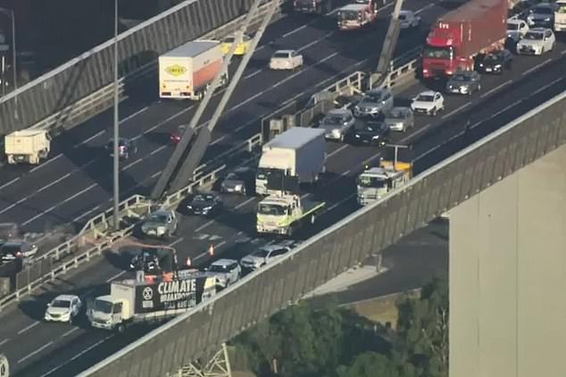 Climate activists have stopped traffic on Melbourne's West Gate Bridge, causing long delays.