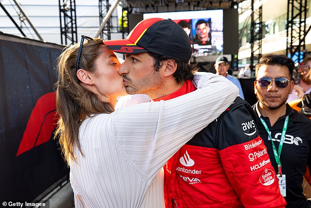 They put on a rare public display of affection at the Mexican GP last October (pictured)