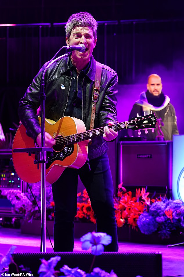 Pep Guardiola was spotted behind Noel Gallagher at a charity concert on Thursday night