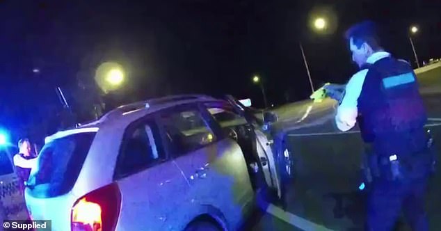 Wild images have been released of a man trying to flee from police despite being shot with a Taser in the chest following a traffic stop in Canberra in September (pictured).