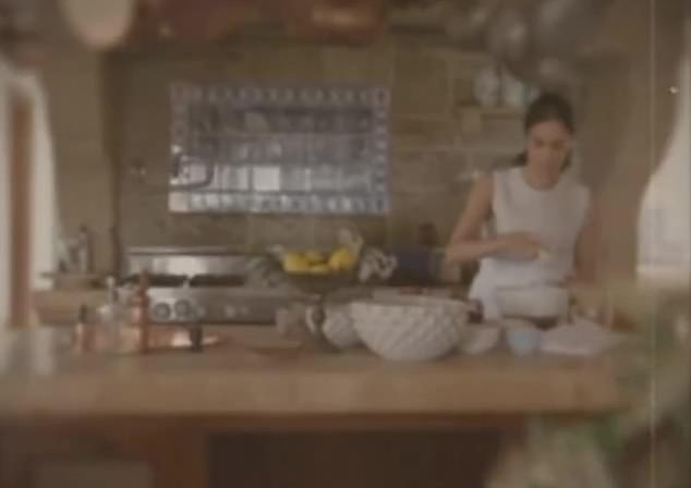 The brand's launch video shows Meghan cooking in a stunning kitchen with copper pots hanging overhead as she whips