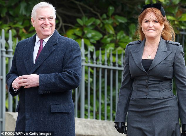 Britain's Prince Andrew, Duke of York and Sarah, Duchess of York smile as they arrive at the memorial service for King Constantine of Greece on February 27
