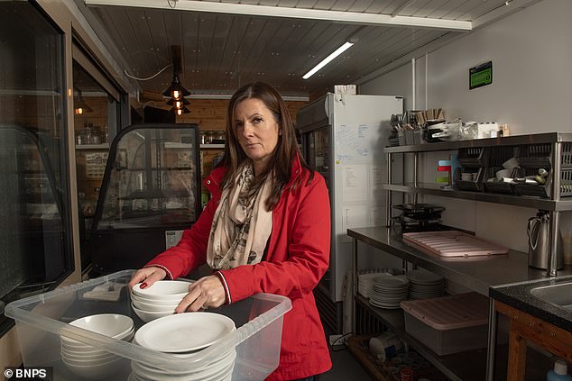 Emma Ayles, 47, (pictured), who had to close her cafe after neighbors complained about the smell of bacon and the clink of teacups, plans to reopen it - across the car park