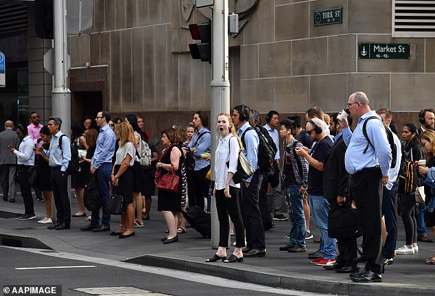Proposed changes to penalty rates and working hours for Australians who work from home could see a major shake-up of flexible working arrangements (pictured, Sydney city workers)
