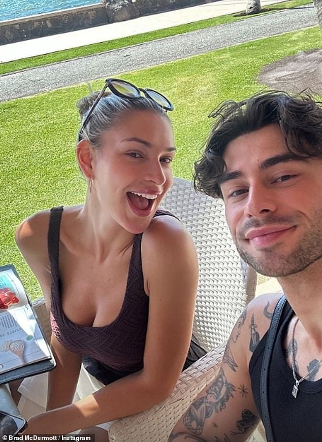 Zara McDermott, 27, refuses to let her stress fracture in her tibia ruin her holiday as she strolled around the resort in an Aircast boot in Gran Canaria on Thursday (pictured with her brother Brad)