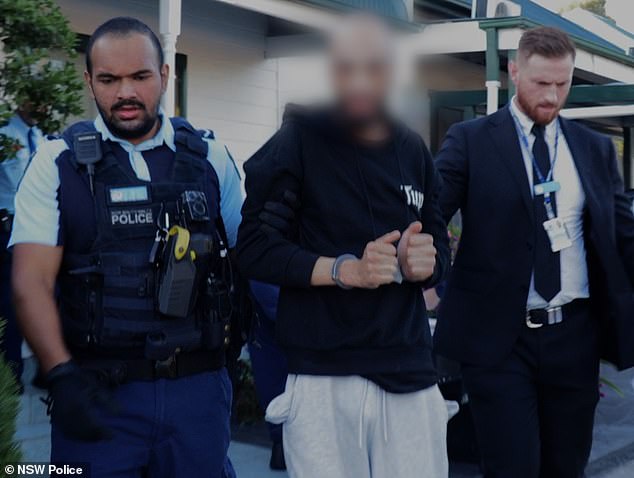 A tenth man (pictured centre), who allegedly took part in a riot outside a western Sydney church after stabbing a bishop, has been charged.