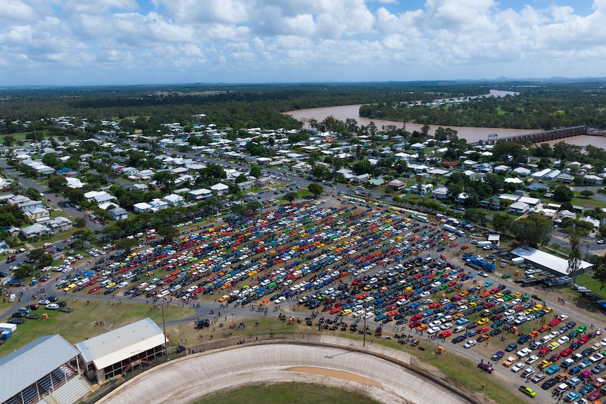 An aerial shot of cars and bicycles.